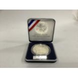 AN American United Service Organisation silver proof Dollar, 1991, in case of issue, certificate