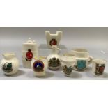 A group of W. H. Goss porcelain overseas souvenirs including Maltese Fire Grate with matching crest,