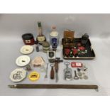 Various bar accessories, bottle openers, bottles, ashtray in the form of an ocean liner funnel,