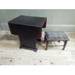 A drop leaf occasional table with under tier and a small stool on turned legs