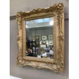 A gilt framed wall mirror 67cm x 57cm