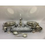 Silver plated ware including two oval entrée dishes and covers with gadroon rims, sugar caster,