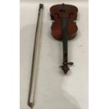 A student's violin together with a bow