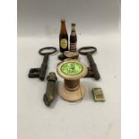 Two antique iron keys of large size, whistle, vintage wooden bobbin, miniature Guiness and Pepsi