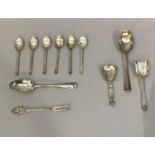 A set of six silver coffee spoons, two Edinburgh silver dessert spoons and a .800 silver pickle fork