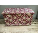 A pine lodging box upholstered with fabric to interior and exterior