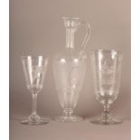 A 19TH CENTURY ETCHED GLASS CLARET JUG, the ovoid tapered body with three flower filled cartouche on