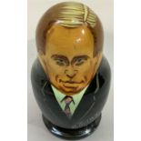 A set of Russian dolls of graduated size each depicting a different Russian president
