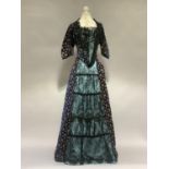 A good late 19th century two-piece costume, in royal blue velvet, with flowers, the skirt trained,
