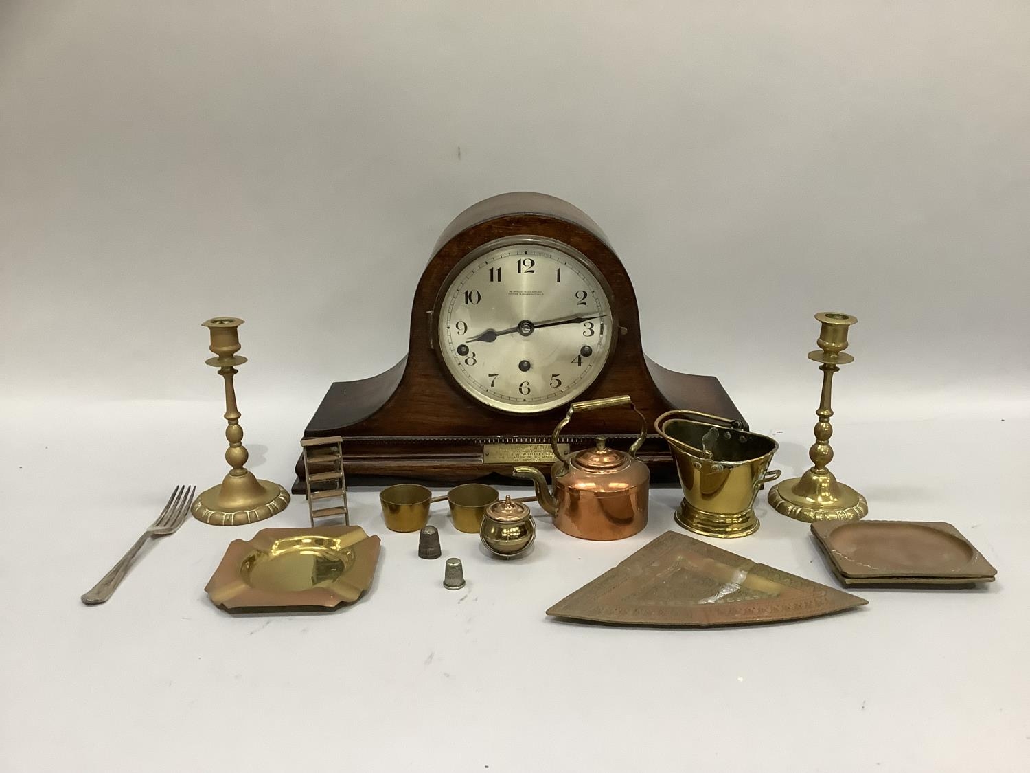 An oak mantle clock by Greenwood & Sons, silver dial with black Arabic numerals with eight day