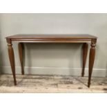 A mahogany finished hall table, rectangular, on reeded legs, 120cm long