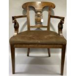 A Regency revival mahogany elbow chair having a pierced vase splat, the arms with bird's head