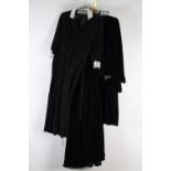 Velvets and Velours, black, comprising a black velvet long-sleeved dress with smocked detail to