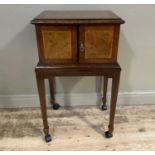 A figured walnut and banded chest canteen having two doors, the stand on square tapered legs with