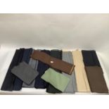 Various remnants of wool cloth and suiting in charcoal grey, chocolate brown, green, navy, khaki,