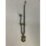 A Victorian watch chain in silver, the single graduated curb link chain hung with a silver shield