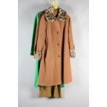 Vintage winter-weight dresses in autumnal colours, together with a camel-coloured wool coat