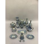 A quantity of Wedgwood blue Jasper ware including vases, lidded box, pin trays, cream jug etc