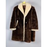 An unusual two-tone lady’s sheepskin jacket, brown with cream trimming