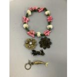An early to mid 20th century shell necklace stained green and pink, approx length 43cm together with