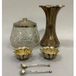 A silver lidded hobnail cut preserve jar, a pair of silver flower head salts with spoons and a