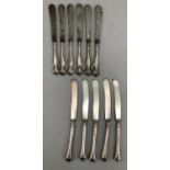 A set of six silver handled and steel bladed tea knives and a set of five silver handled tea knives
