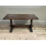 An oak coffee table on refectory supports, 90cm wide
