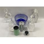 Four various cut glass decanters, a blue flashed and clear cut fruit bowl, a pewter bottle stopper