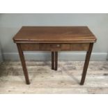 A 19th century mahogany fold over tea table with small drawer to the apron and on moulded square