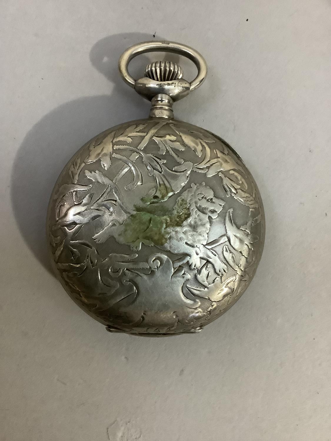 An early 20th century 8 day pocket watch by Hebdomas in a.800 Continental silver case, chased to the - Image 2 of 2