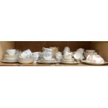 A Tuscan china blue floral tea service of six cups, six saucers, six tea plates, bread and butter