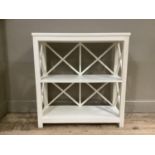 A cream finished open bookcase with X panel sides and back, 86cm wide by 90cm high