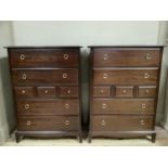 A pair of five height Stag Minstrel chest of drawers each with an arrangement of two long, three