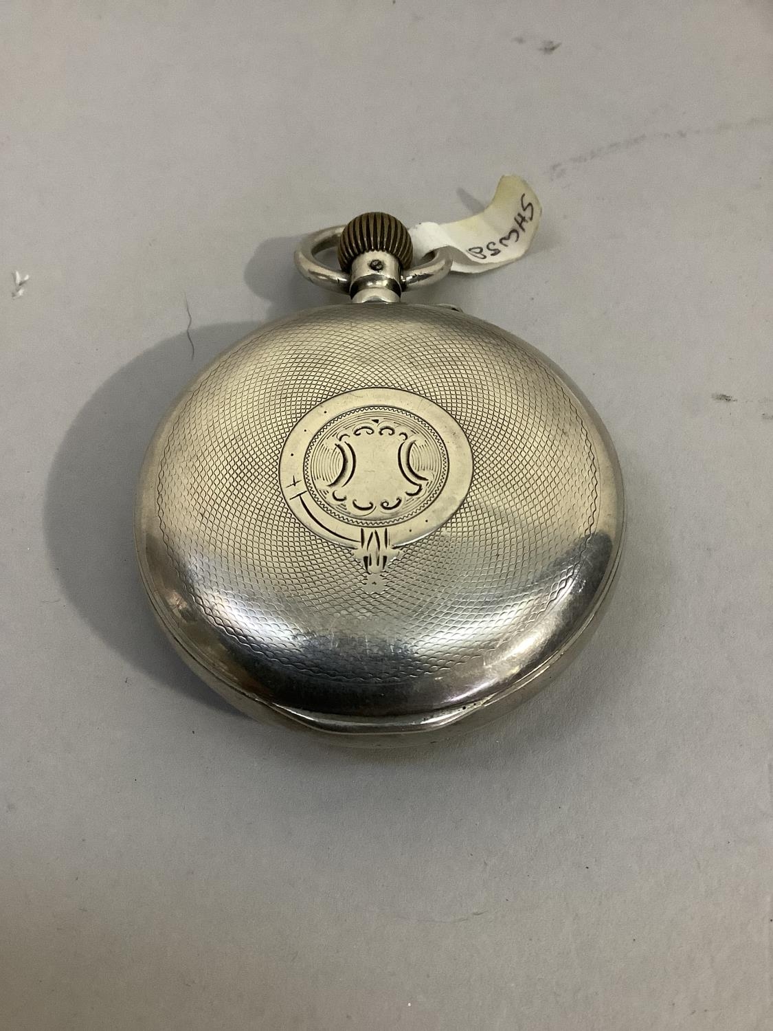 A late 19th century pocket watch alarm in open faced silver case with Swiss hallmarks, approximate - Image 3 of 3