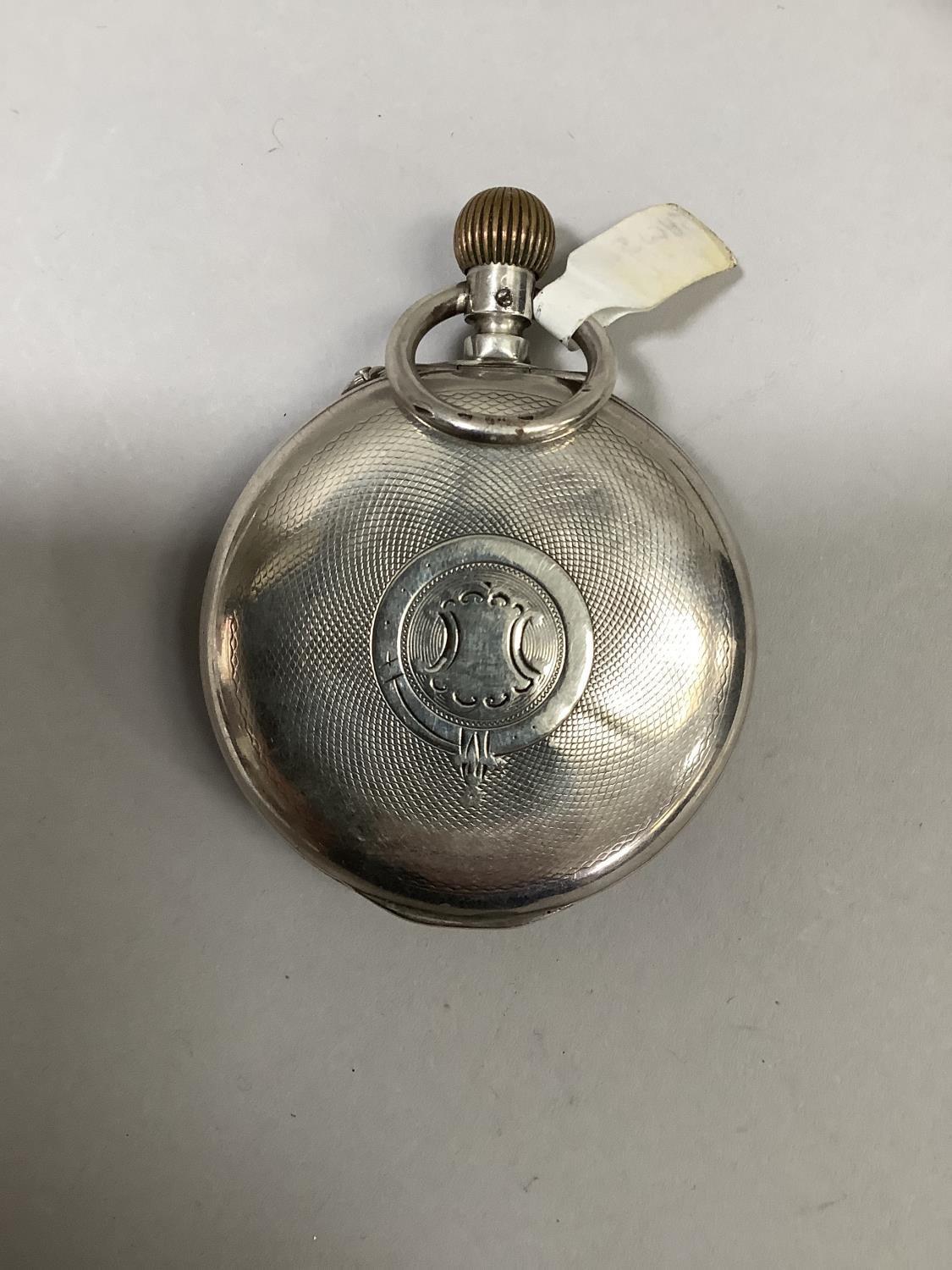 A late 19th century pocket watch alarm in open faced silver case with Swiss hallmarks, approximate - Image 2 of 3