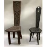 Two dark oak spinning chairs