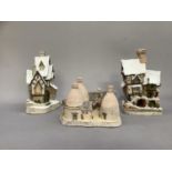 Three model buildings: Fred's Home, Old Joe's Beetling Shop, David Winter Cottage