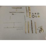 A small quantity of scrap 9ct gold, approximate weight 18gm together with a collection of rolled