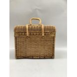 A wicker basket with carrying handles