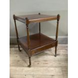 A mahogany and crossbanded side table of square outline with under tier and drawer, on slender