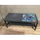 A grey finished coffee table with inset colour jungle print of a toucan, under glass, 107cm by 47cm