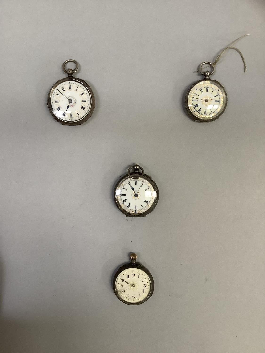 Four ladies late 19th century fob watches in open faced silver cases with polychrome enamel dials (