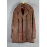 A “Taube Collection” three-quarter length fur jacket, in pale caramel, possibly rabbit, with good
