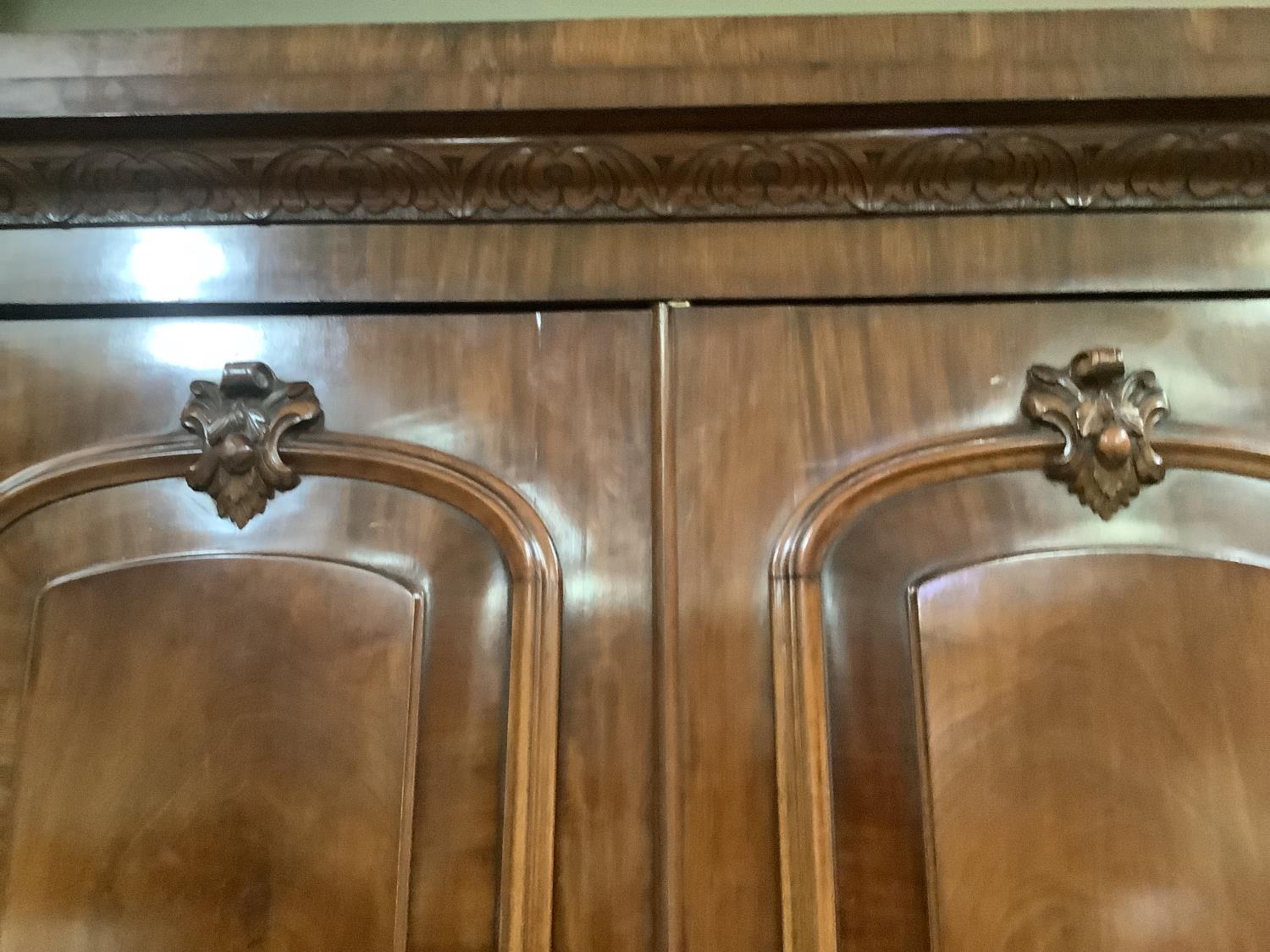 A Victorian mahogany crossbanded two drawer wardrobe having a moulded and foliate carved cornice - Image 3 of 5