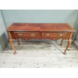A reproduction walnut and yew wood veneer low set side table with two drawers and undertier, 134cm