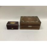 A 19th century rosewood and mother of pearl inlaid work box, the interior lined in pink silk with