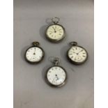 Four late 19th century and early 20th century pocket watches, all in open faced silver cases, all