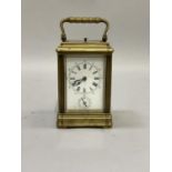 A 19th century French Carriage Alarm repeating strike clock, lever escapement, white enamel dial
