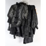 Victorian to Edwardian costume, black, comprising a ruffled taffeta cape with cutwork detail; a