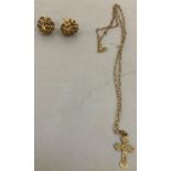 A 9ct gold cross and chain together with a pair of gold stud earrings (at fault), total